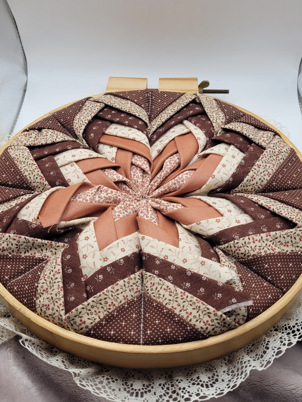 handmade quilted folded star mounted in a wooden embroidery hoop Wall Hanging